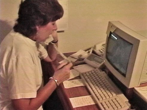 Chris working the phone with one of Phantom's early Macs