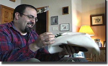Ken opening Anthony's present at Colorado Drive's first Christmas