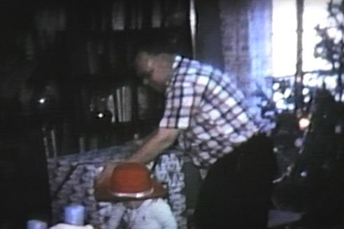 Martin's Dad getting ready to give Mom big present