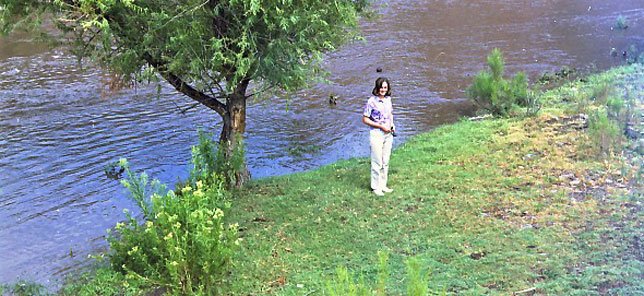 Carol beside water running between Ft Davis and Balmorhea around 1967